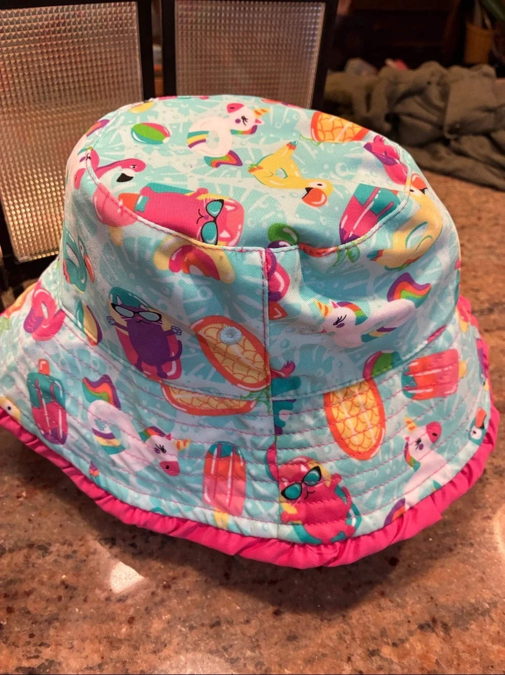 UV Skinz Reversible Bucket Hat Pink side/tropical pattern side UPF 50+, size 6